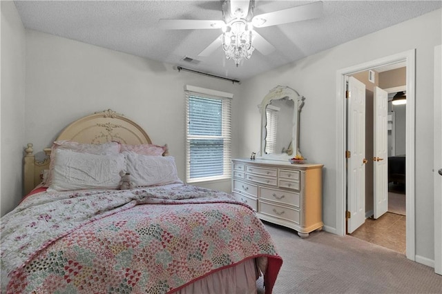 5318 W 159th Ter, Overland Park, KS 66085 - bedroom featuring carpet floors, a textured ceiling, a ceiling fan, and baseboards