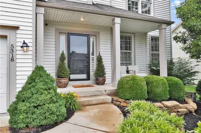 5318 W 159th Ter, Overland Park, KS 66085 - view of exterior entry featuring covered porch and a shingled roof