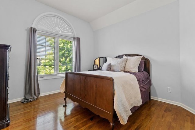 8127 Lone Elm Rd, Lenexa, KS 66220 - bedroom featuring wood finished floors, baseboards, and lofted ceiling