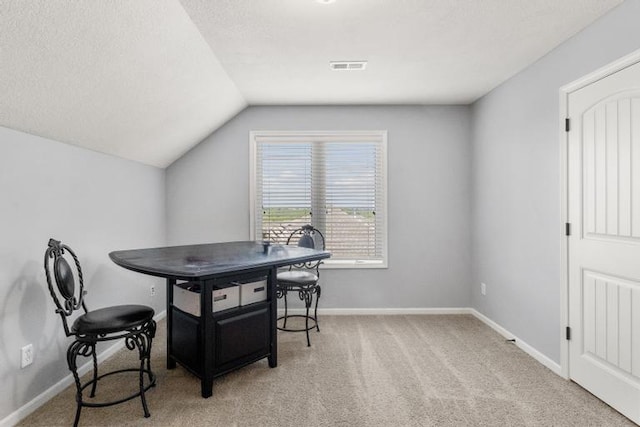 8127 Lone Elm Rd, Lenexa, KS 66220 - dining area with lofted ceiling, light colored carpet, and baseboards