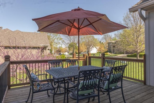 8127 Lone Elm Rd, Lenexa, KS 66220 - wooden deck with outdoor dining area and a lawn