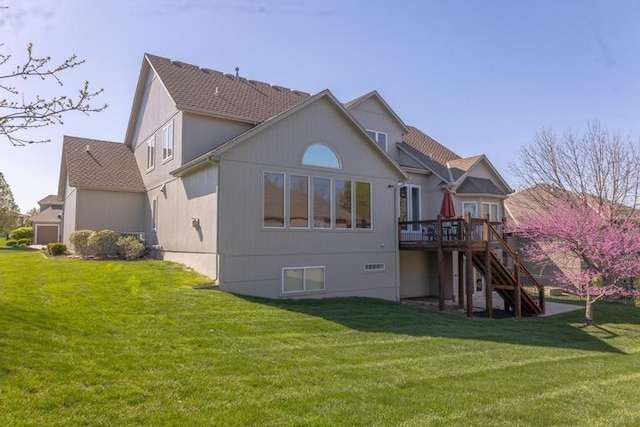 8127 Lone Elm Rd, Lenexa, KS 66220 - back of house with stairs, a wooden deck, and a lawn