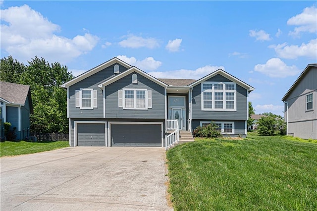 split foyer home featuring a garage and driveway