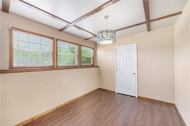 unfurnished room featuring wood finished floors, baseboards, beamed ceiling, and coffered ceiling