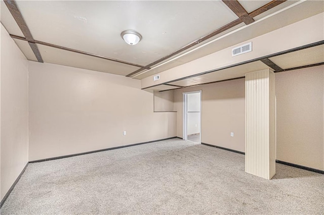 finished below grade area featuring carpet flooring and baseboards