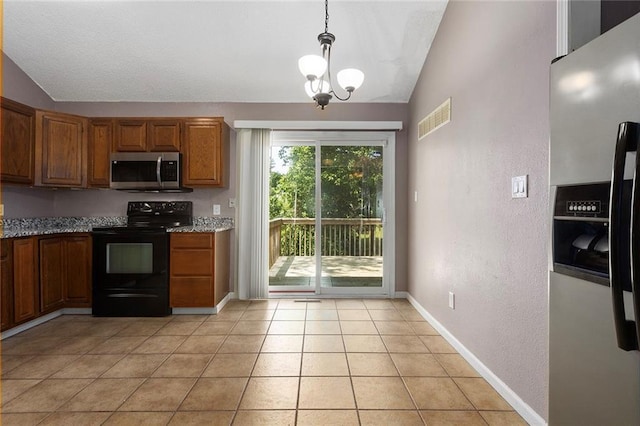 4010 Hedges Ave, Kansas City, MO 64133 - kitchen featuring appliances with stainless steel finishes, vaulted ceiling, a chandelier, brown cabinets, and pendant lighting