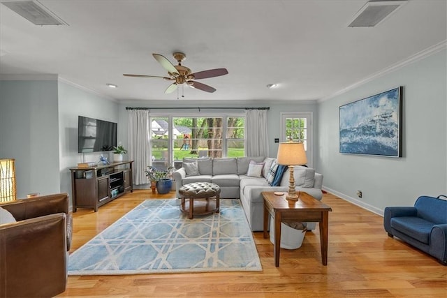 2819 W 89th St, Leawood, KS 66206 - living area with crown molding, light wood finished floors, a ceiling fan, baseboards, and recessed lighting