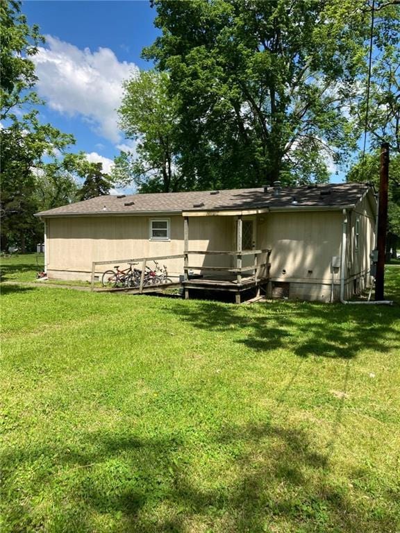 206 W 5th St, Pleasanton, KS 66075 - rear view of property featuring a yard and crawl space