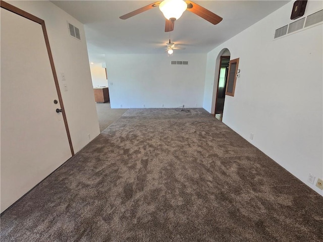 33295 Bethel Church Rd, Osawatomie, KS 66064 - carpeted empty room featuring a ceiling fan and arched walkways