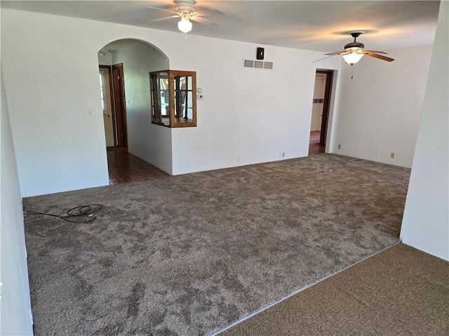 33295 Bethel Church Rd, Osawatomie, KS 66064 - carpeted spare room with a ceiling fan and arched walkways