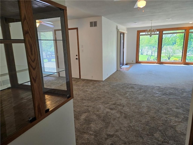33295 Bethel Church Rd, Osawatomie, KS 66064 - unfurnished room with ceiling fan, carpet floors, and a chandelier