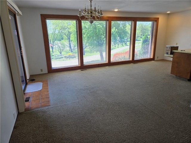 33295 Bethel Church Rd, Osawatomie, KS 66064 - unfurnished living room featuring a chandelier and carpet floors