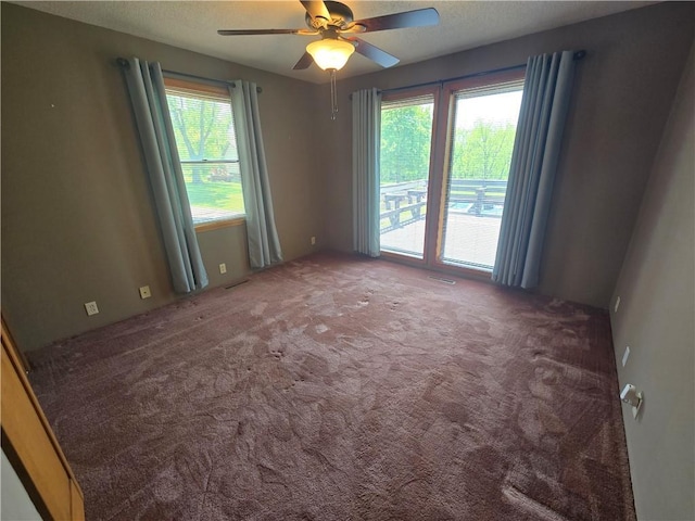 33295 Bethel Church Rd, Osawatomie, KS 66064 - carpeted empty room with a ceiling fan