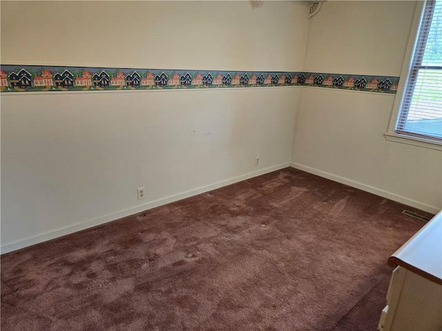 33295 Bethel Church Rd, Osawatomie, KS 66064 - unfurnished room featuring dark colored carpet and baseboards