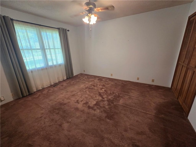 33295 Bethel Church Rd, Osawatomie, KS 66064 - carpeted empty room with ceiling fan