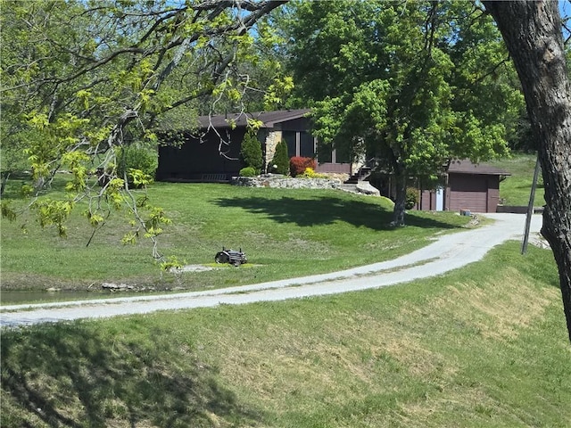 33295 Bethel Church Rd, Osawatomie, KS 66064 - view of front of property with a garage, a front lawn, and driveway
