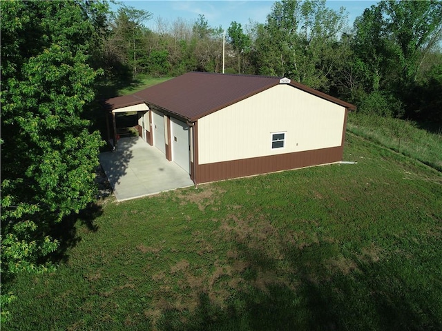 33295 Bethel Church Rd, Osawatomie, KS 66064 - view of property exterior with a yard and metal roof