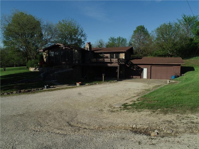 33295 Bethel Church Rd, Osawatomie, KS 66064 - view of front facade with a chimney, dirt driveway, a front yard, and stairway