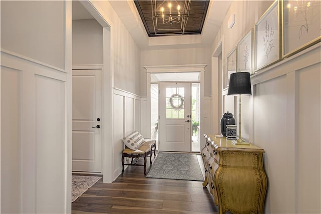 11410 Bluestem Dr, Kearney, MO 64060 - mudroom featuring a decorative wall, dark wood-style floors, wainscoting, and a chandelier