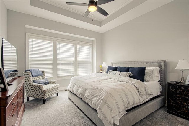11410 Bluestem Dr, Kearney, MO 64060 - carpeted bedroom featuring a raised ceiling, a ceiling fan, crown molding, and baseboards