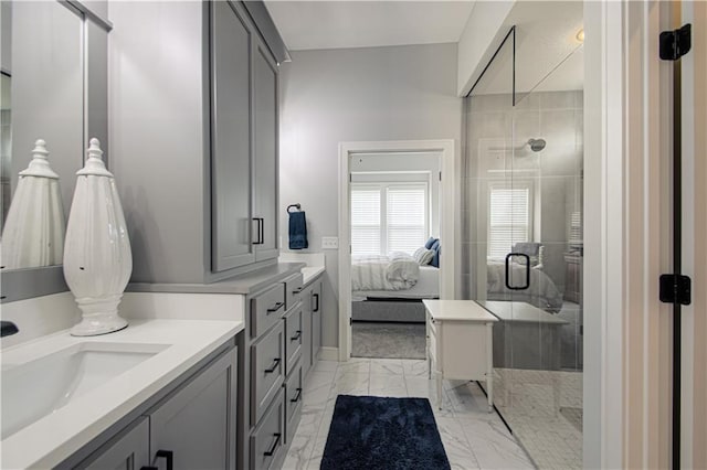 11410 Bluestem Dr, Kearney, MO 64060 - ensuite bathroom with a stall shower, vanity, marble finish floors, and baseboards