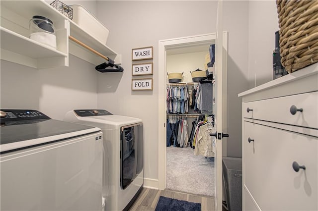 11410 Bluestem Dr, Kearney, MO 64060 - clothes washing area featuring separate washer and dryer and wood finished floors