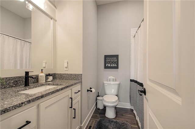 11410 Bluestem Dr, Kearney, MO 64060 - full bath featuring toilet, wood finished floors, vanity, and baseboards