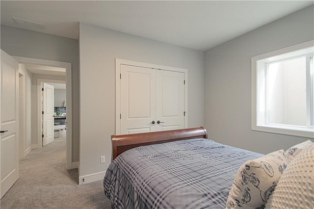 11410 Bluestem Dr, Kearney, MO 64060 - bedroom with light carpet, a closet, and baseboards