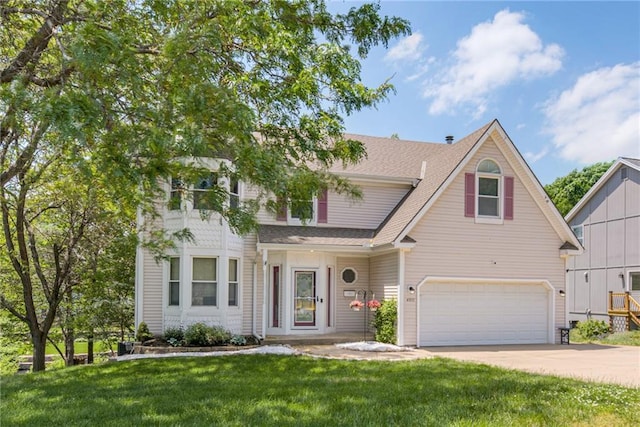 4901 NW 87th St, Kansas City, MO 64154 - traditional-style home with an attached garage, roof with shingles, concrete driveway, and a front yard