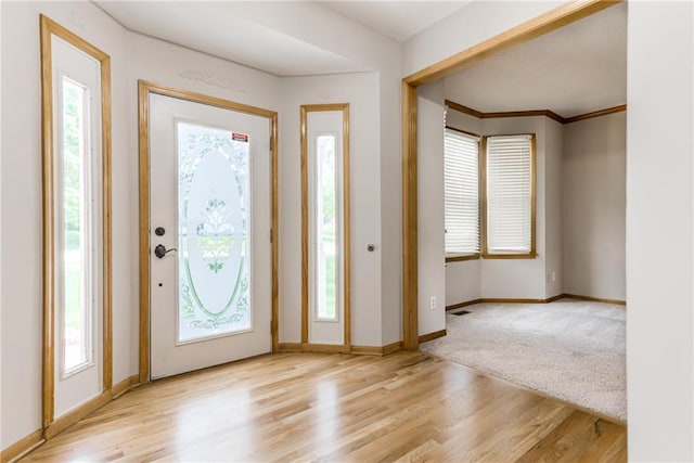 4901 NW 87th St, Kansas City, MO 64154 - foyer entrance with wood finished floors, baseboards, and healthy amount of natural light