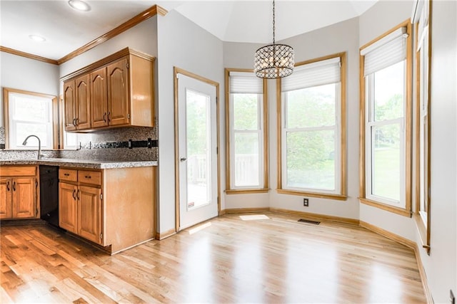 4901 NW 87th St, Kansas City, MO 64154 - kitchen featuring a sink, a chandelier, light wood finished floors, dishwasher, and healthy amount of natural light