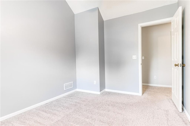 4901 NW 87th St, Kansas City, MO 64154 - empty room featuring light colored carpet, baseboards, and lofted ceiling