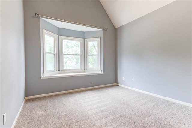 4901 NW 87th St, Kansas City, MO 64154 - spare room featuring carpet flooring, baseboards, and lofted ceiling