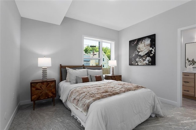 carpeted bedroom with baseboards