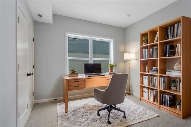 home office with carpet flooring and baseboards