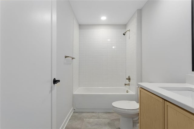 full bath featuring toilet, shower / tub combination, vanity, baseboards, and tile patterned floors