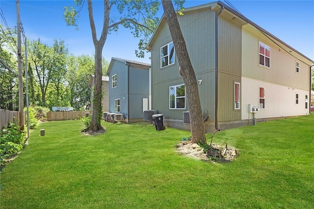back of house featuring central air condition unit