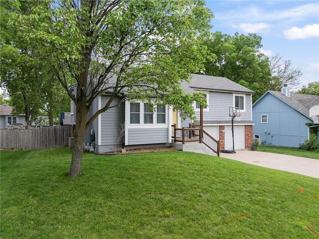 15328 W 81st St, Lenexa, KS 66219 - view of front facade featuring driveway, an attached garage, brick siding, and central AC