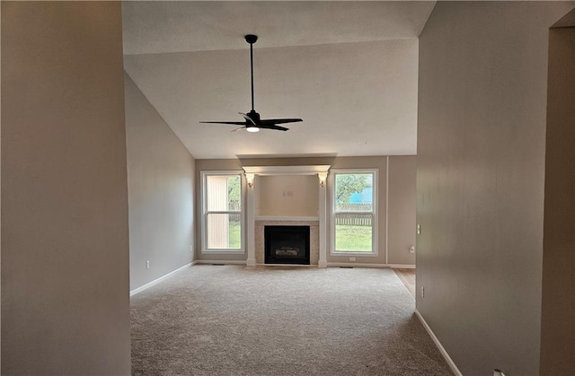 1309 Thomas Dr, Louisburg, KS 66053 - unfurnished living room with baseboards, carpet floors, ceiling fan, healthy amount of natural light, and high vaulted ceiling