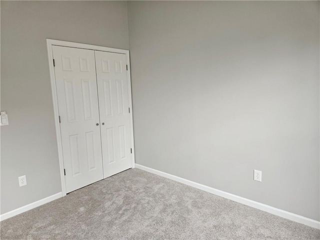1309 Thomas Dr, Louisburg, KS 66053 - unfurnished bedroom featuring carpet, a closet, and baseboards