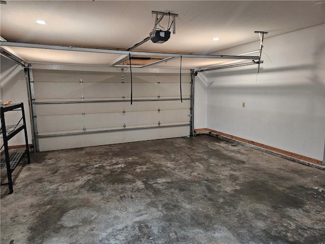 1309 Thomas Dr, Louisburg, KS 66053 - garage featuring a garage door opener and baseboards