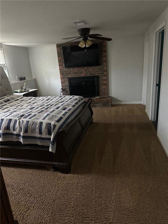 bedroom featuring carpet floors, a fireplace, ceiling fan, and baseboards