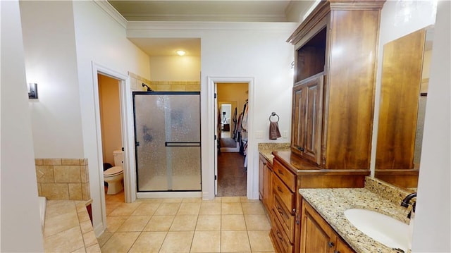 4301 N 141st St, Basehor, KS 66007 - full bath with a shower stall, tile patterned floors, toilet, vanity, and ornamental molding