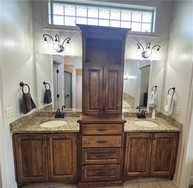 4301 N 141st St, Basehor, KS 66007 - bathroom featuring double vanity, a shower stall, and tile patterned floors