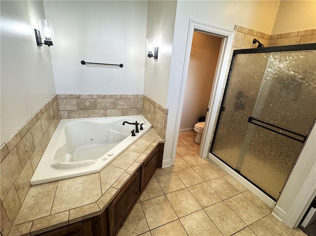 4301 N 141st St, Basehor, KS 66007 - bathroom with a tub with jets, toilet, a stall shower, and tile patterned flooring