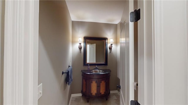 4301 N 141st St, Basehor, KS 66007 - half bath with baseboards, tile patterned flooring, and vanity
