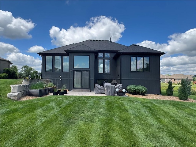 4301 N 141st St, Basehor, KS 66007 - rear view of property featuring a lawn and a shingled roof