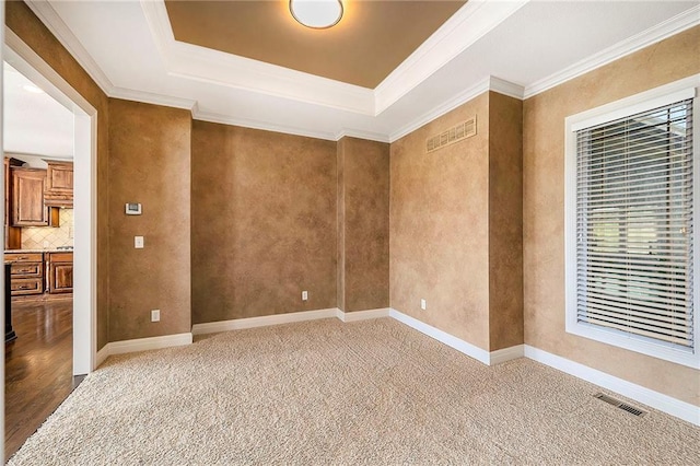 4301 N 141st St, Basehor, KS 66007 - carpeted spare room featuring a raised ceiling and crown molding