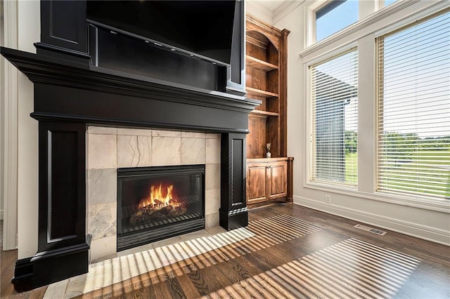 4301 N 141st St, Basehor, KS 66007 - detailed view of a fireplace, wood finished floors, ornamental molding, and built in features