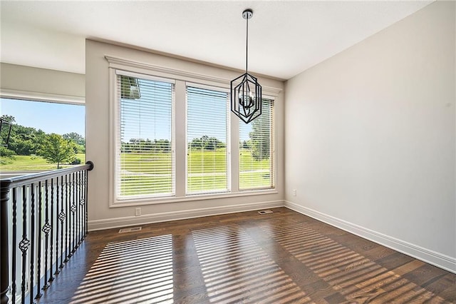 4301 N 141st St, Basehor, KS 66007 - unfurnished dining area featuring a chandelier and wood finished floors